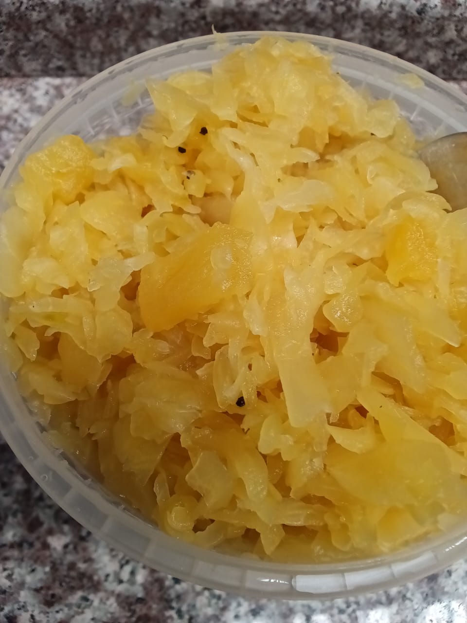 Close-up of Fermentastic Pineapple Kraut with golden cabbage, pineapple and black pepper