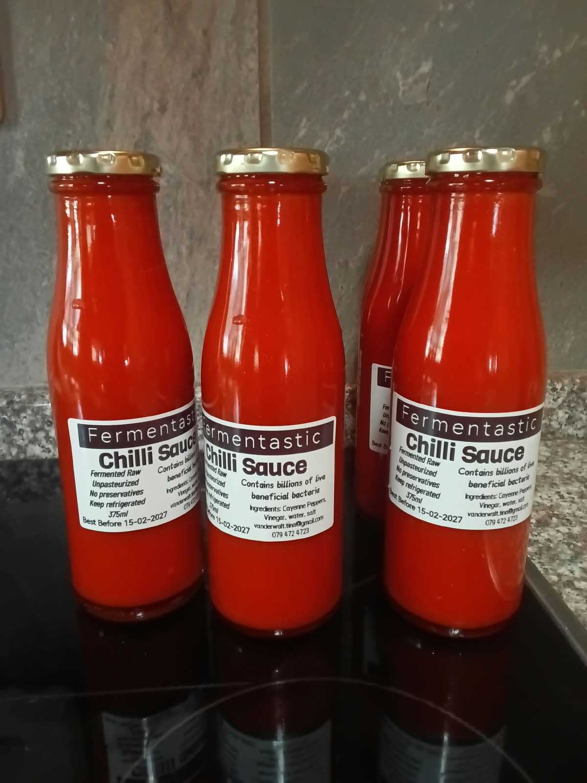 Three bottles of Fermentastic Chilli Sauce — raw fermented cayenne pepper hot sauce
