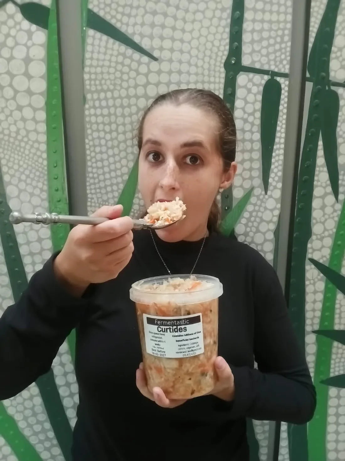 Kristi eating Fermentastic Curtido, a raw unpasteurised cabbage ferment with carrots and fresh oregano