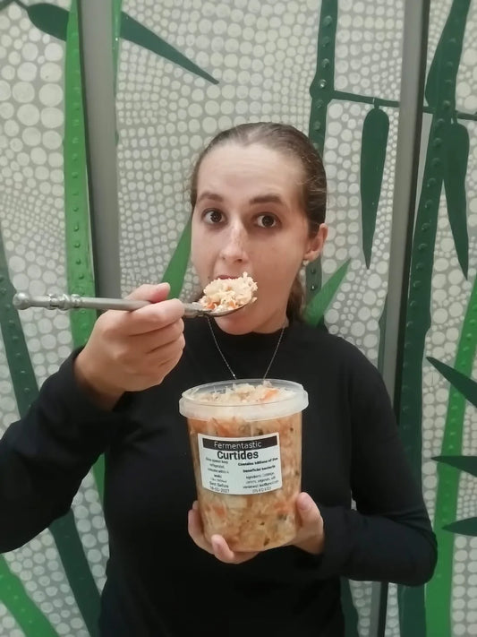 Kristi eating Fermentastic Curtido, a raw unpasteurised cabbage ferment with carrots and fresh oregano